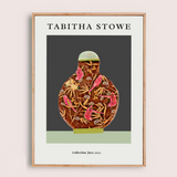 Framed artwork of a decorative jar with pink birds on a dark background, featuring the artist 'Tabitha Stowe'.