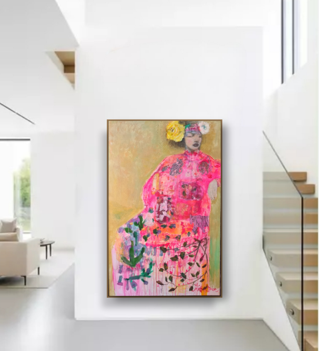 Colorful painting of a woman in a floral dress hanging on a white wall in a modern home.