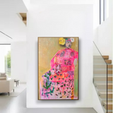 Colorful painting of a woman in a floral dress hanging on a white wall in a modern home.