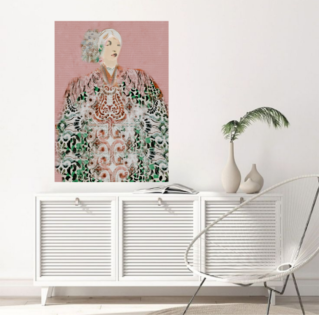 Framed artwork of a woman with a pink background on a white wall above a white cabinet.
