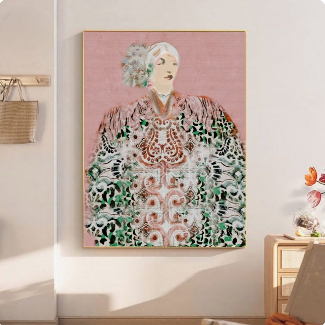 Framed artwork of a boho women art workwearing an ornate garment on a wall in a room.